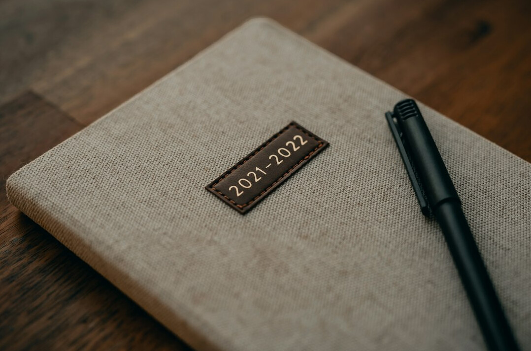 writer at desk with notebook