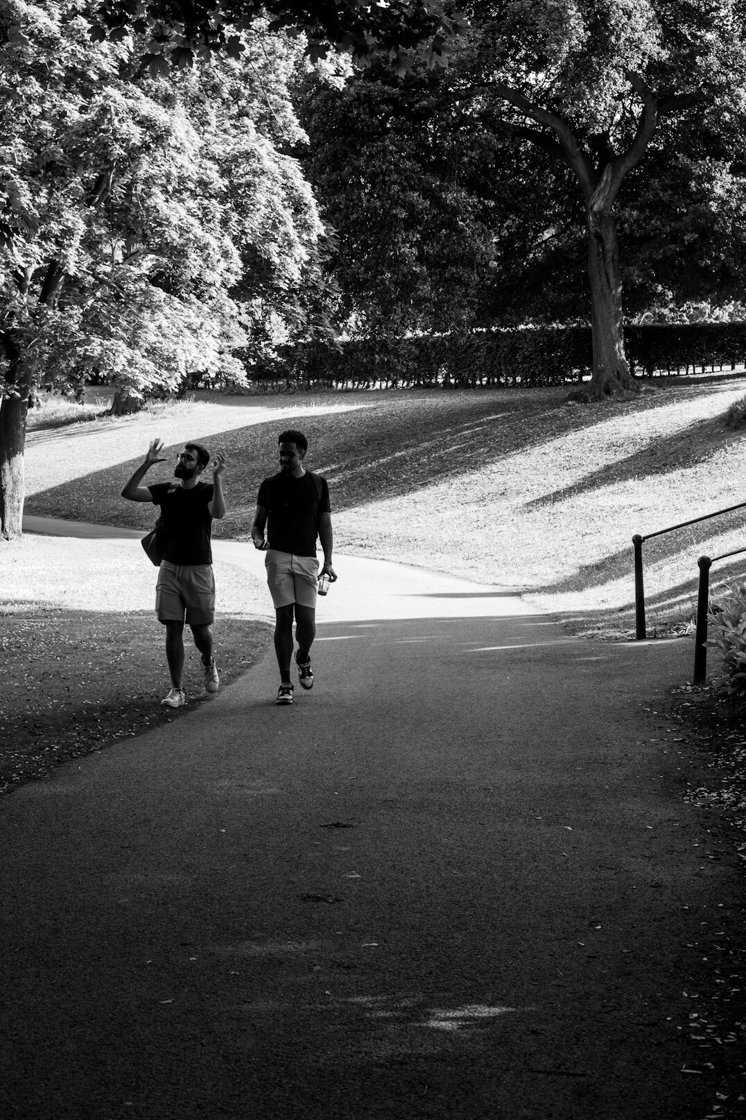two people talking in shadow